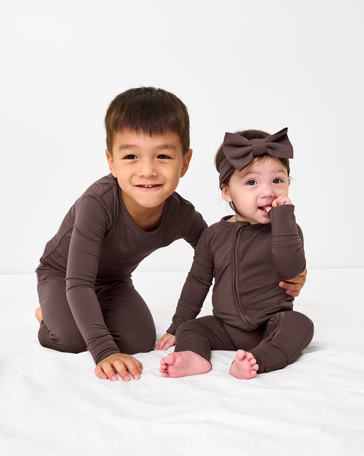 Two children wearing matching Dark Chocolate pajamas