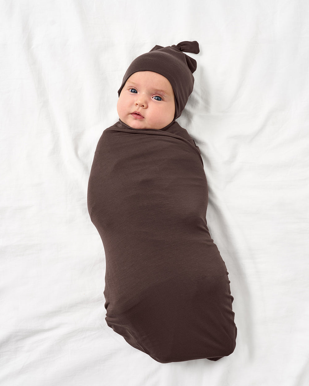 Baby in Dark Chocolate Swaddle & Hat set.
