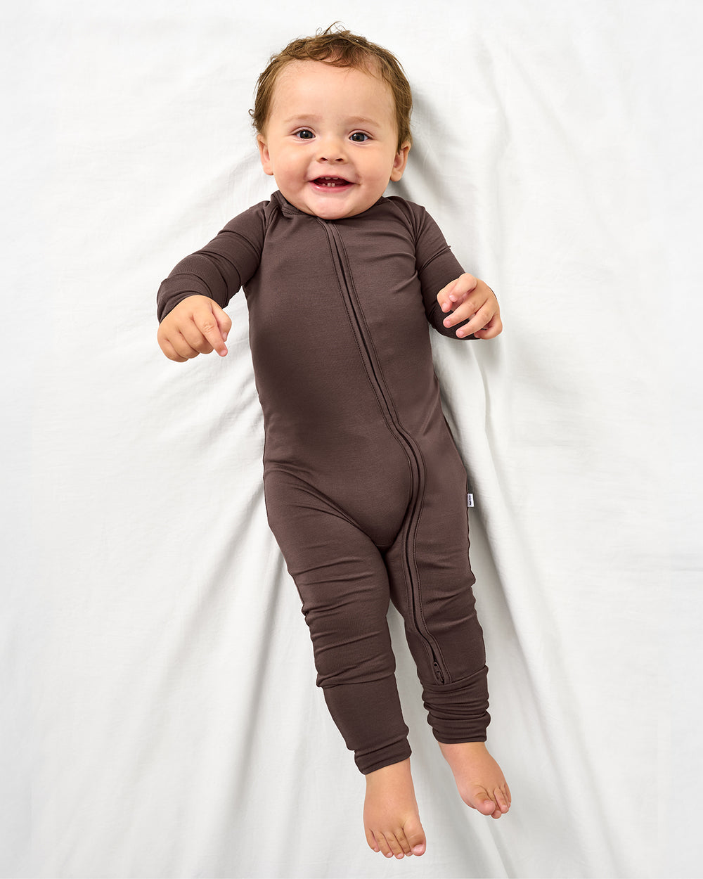 Aerial view of baby wearing the Dark Chocolate Zippy