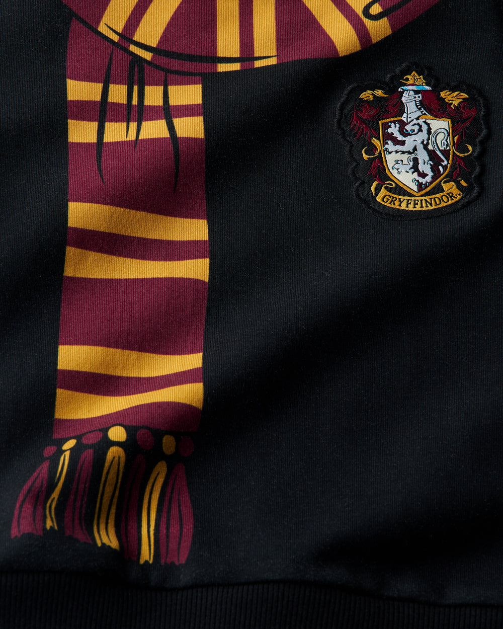 Close up of the graphic details on the Harry Potter™ Gryffindor Crewneck Sweatshirt