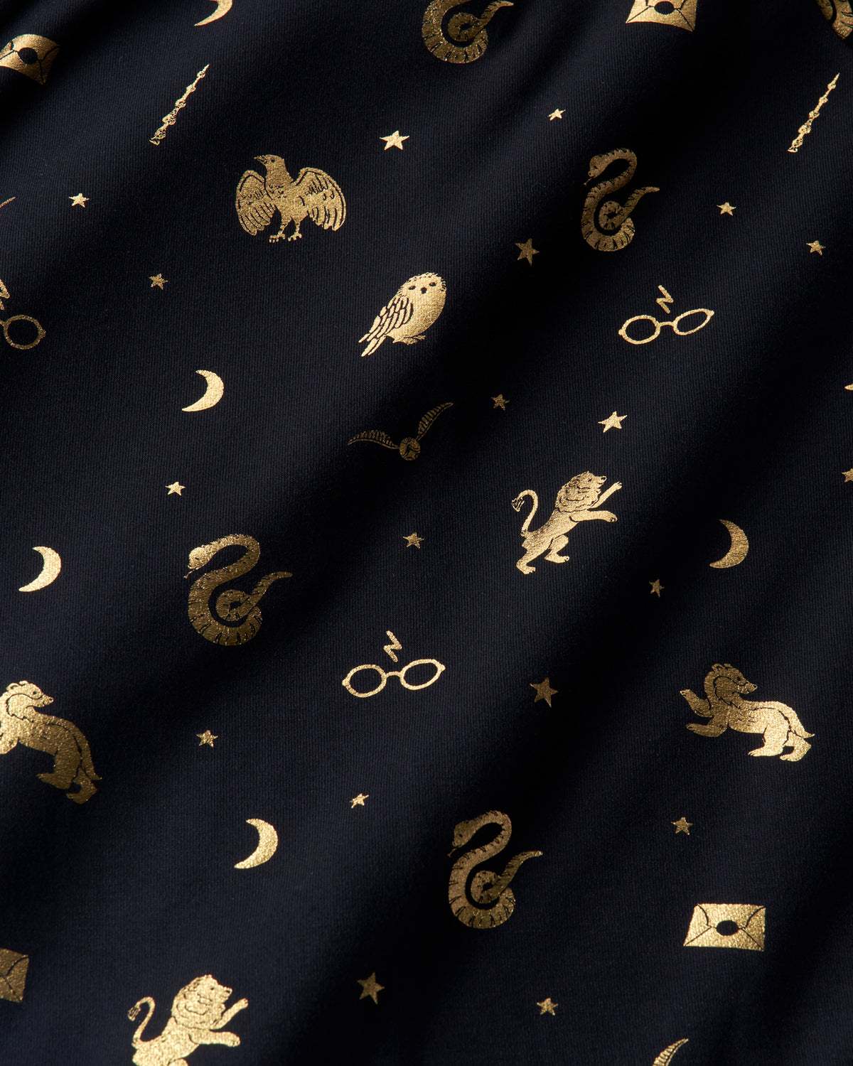 Close up of the metallic details on the Harry Potter™ Spellbinding Studies fabric