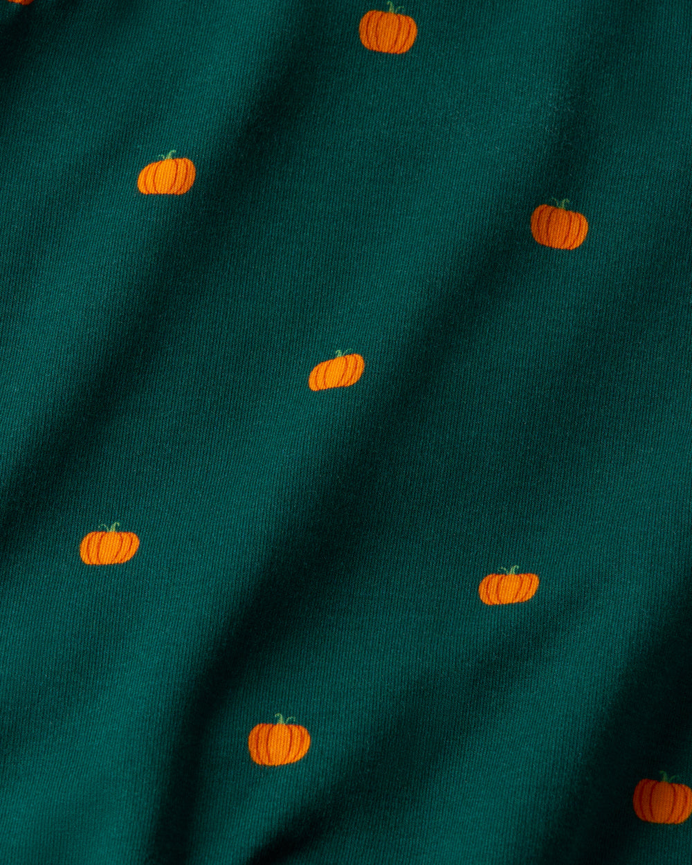 Close up of the Mini Pumpkins Skirt Overall Dress fabric