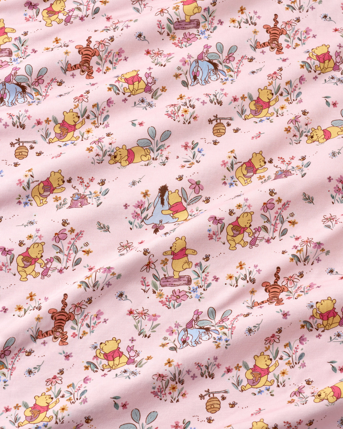 Close up of the pink Winnie The Pooh fabric