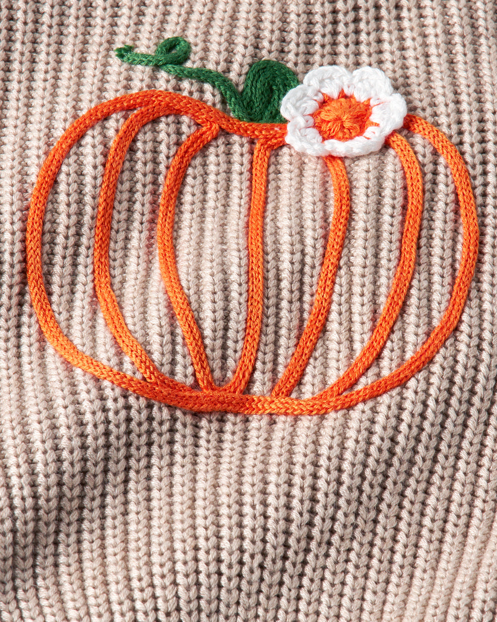 Close up of the pumpkin stitching on the Pumpkin Drop Shoulder Sweater