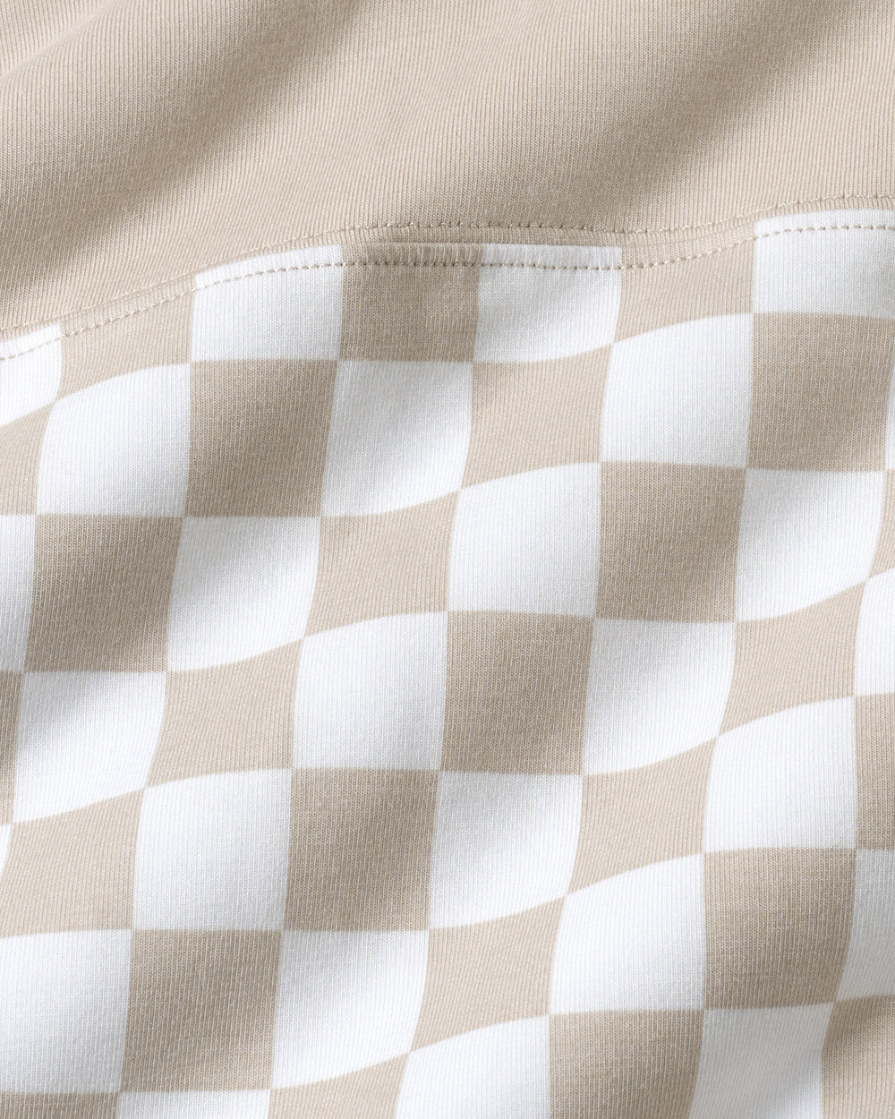 Close up of the checkered print on the Stone Checks Relaxed Hooded Tee