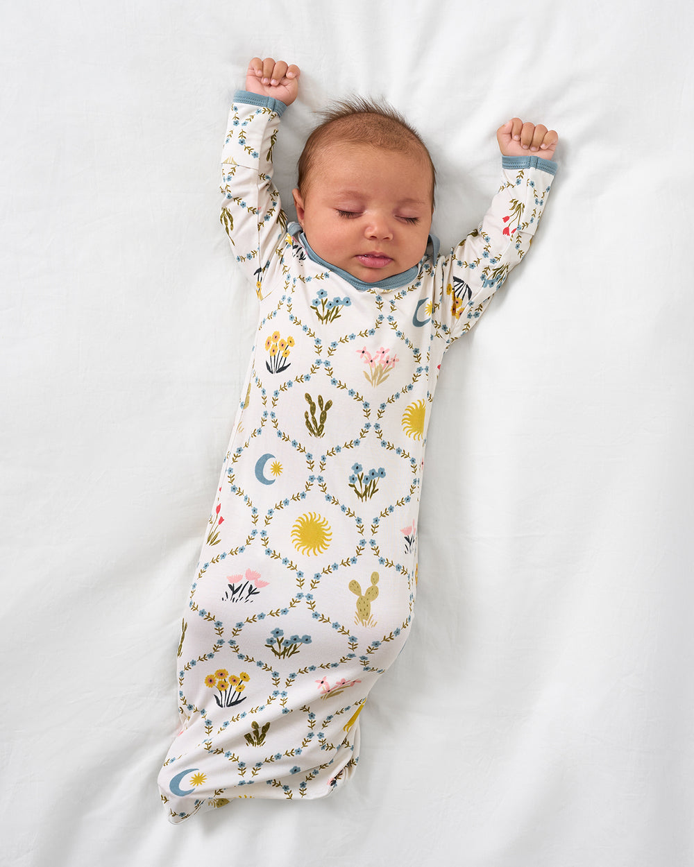Alternate aerial view of newborn wearing the Desert Meadow Infant Gown