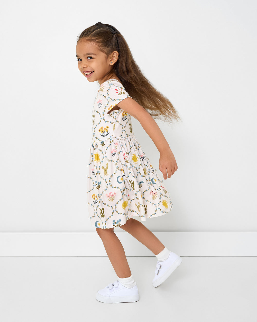 Girl in motion wearing the Desert Meadow Ribbed Skater Dress