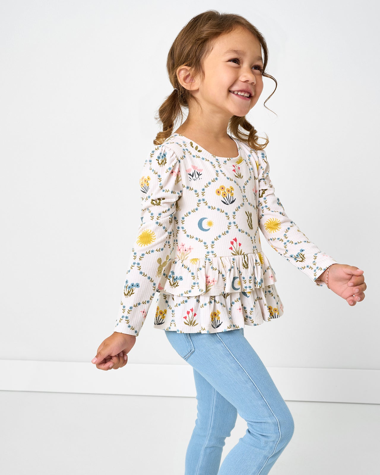 Girl wearing the Western Themed Desert Meadow Ribbed Tiered Peplum Top