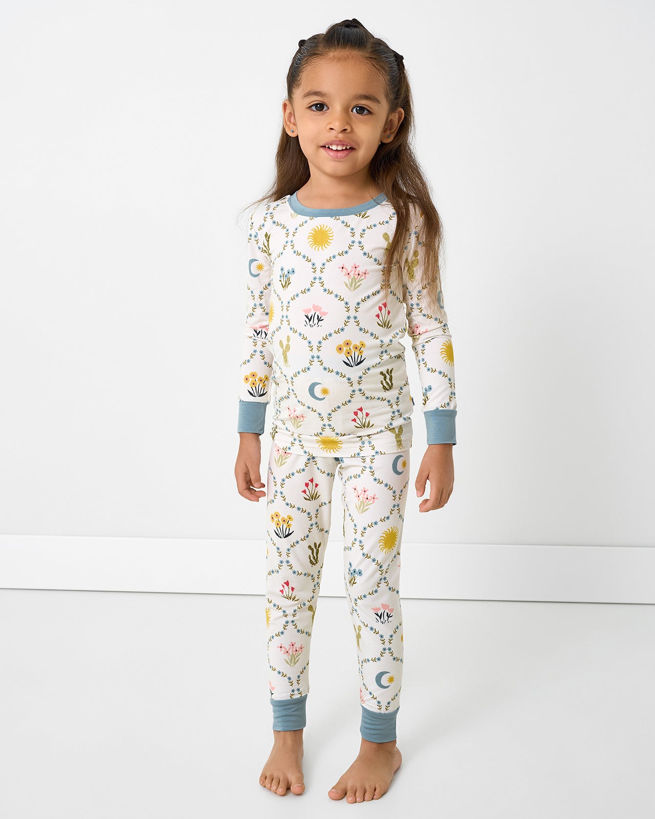 Standing girl wearing the Desert Meadow Two-Piece Pajama Set