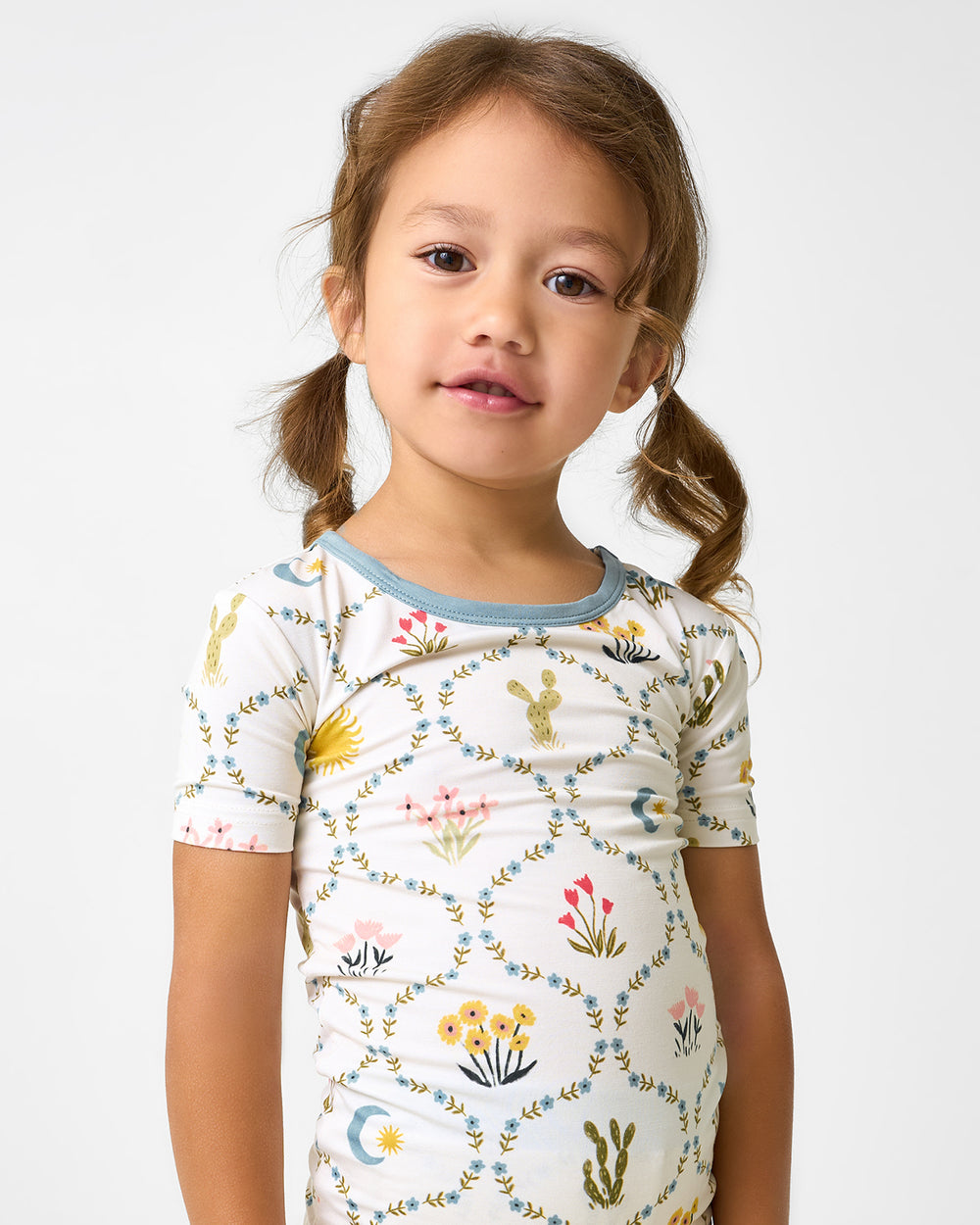 Close up of girl wearing the Desert Meadow Two-Piece Short Sleeve & Shorts Pajama Set