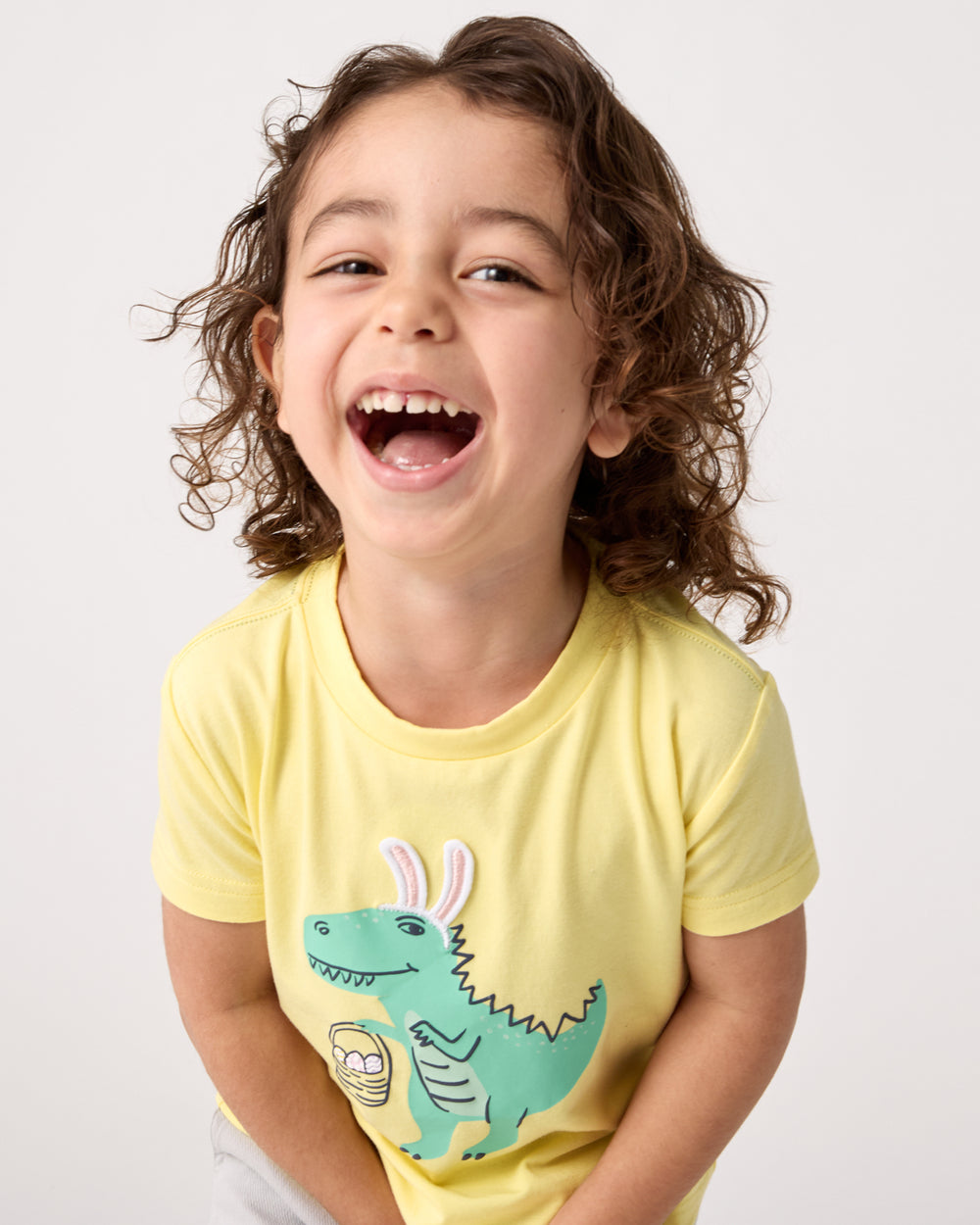 Close up of boy wearing the Dino Egg Hunter Relaxed Tee