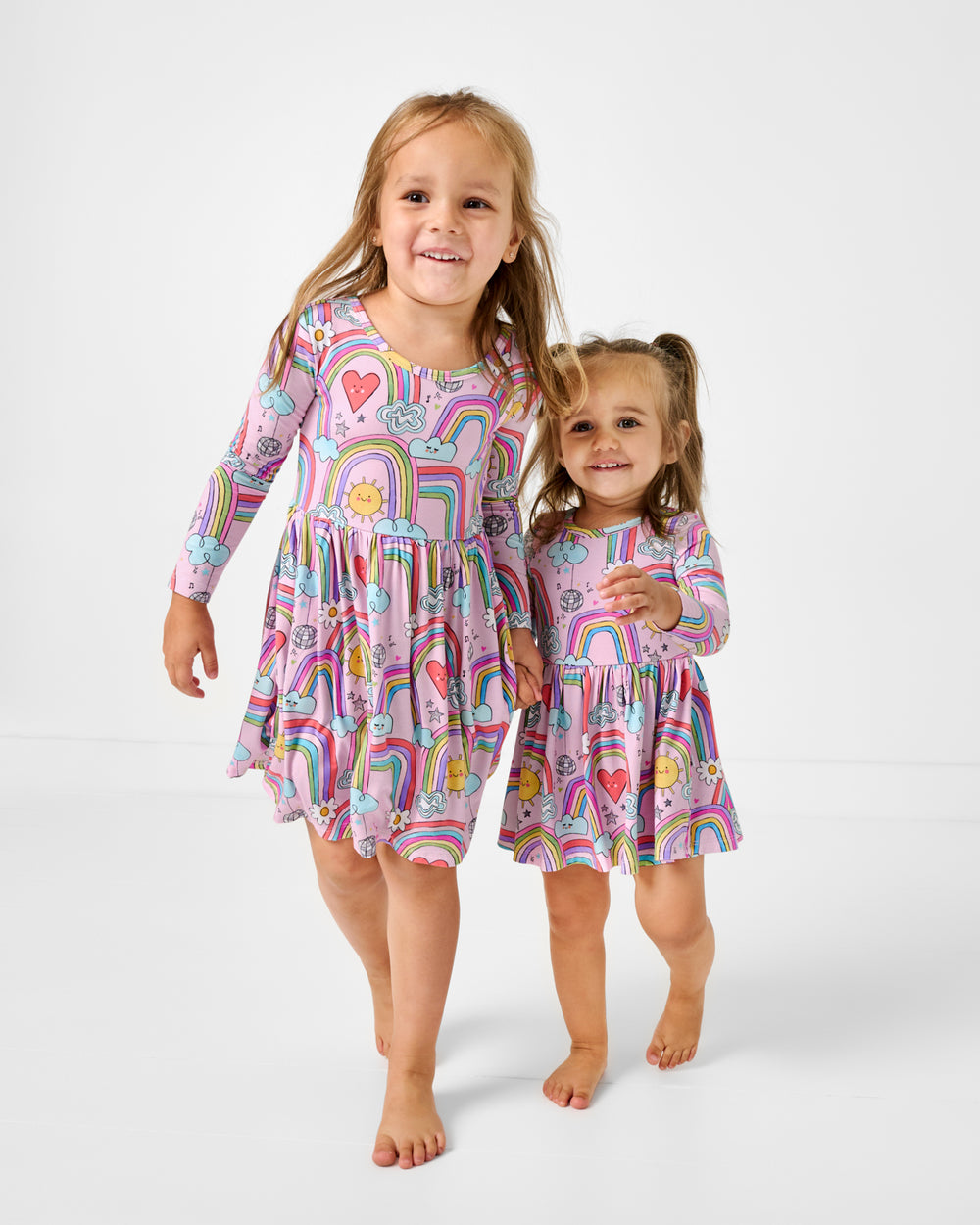 Two girls wearing Disco Rainbows Skater Dresses