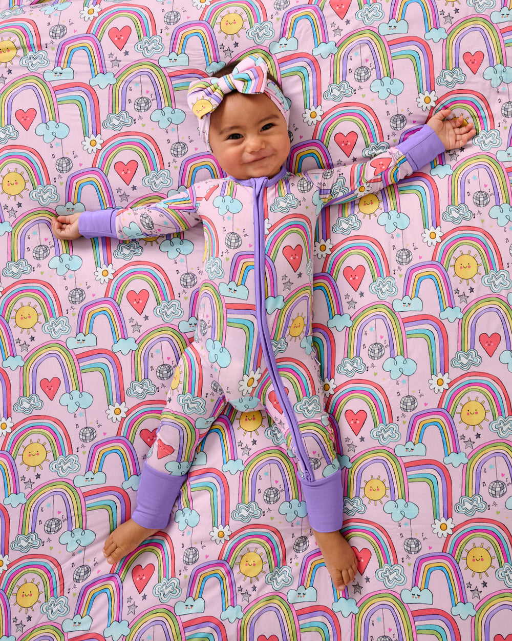 Baby laying on the Disco Rainbows Large Cloud Blanket®