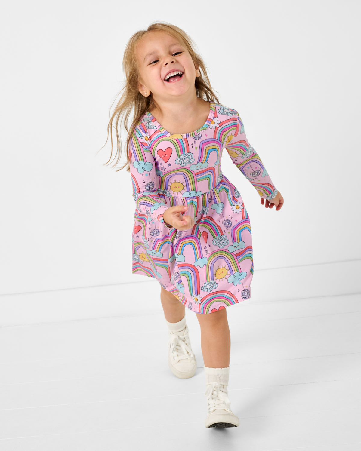 Running girl wearing the Disco Rainbows Skater Dress