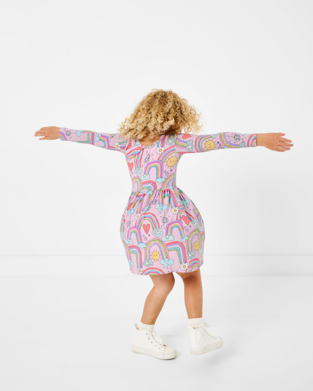 Twirling girl wearing the Disco Rainbows Skater Dress