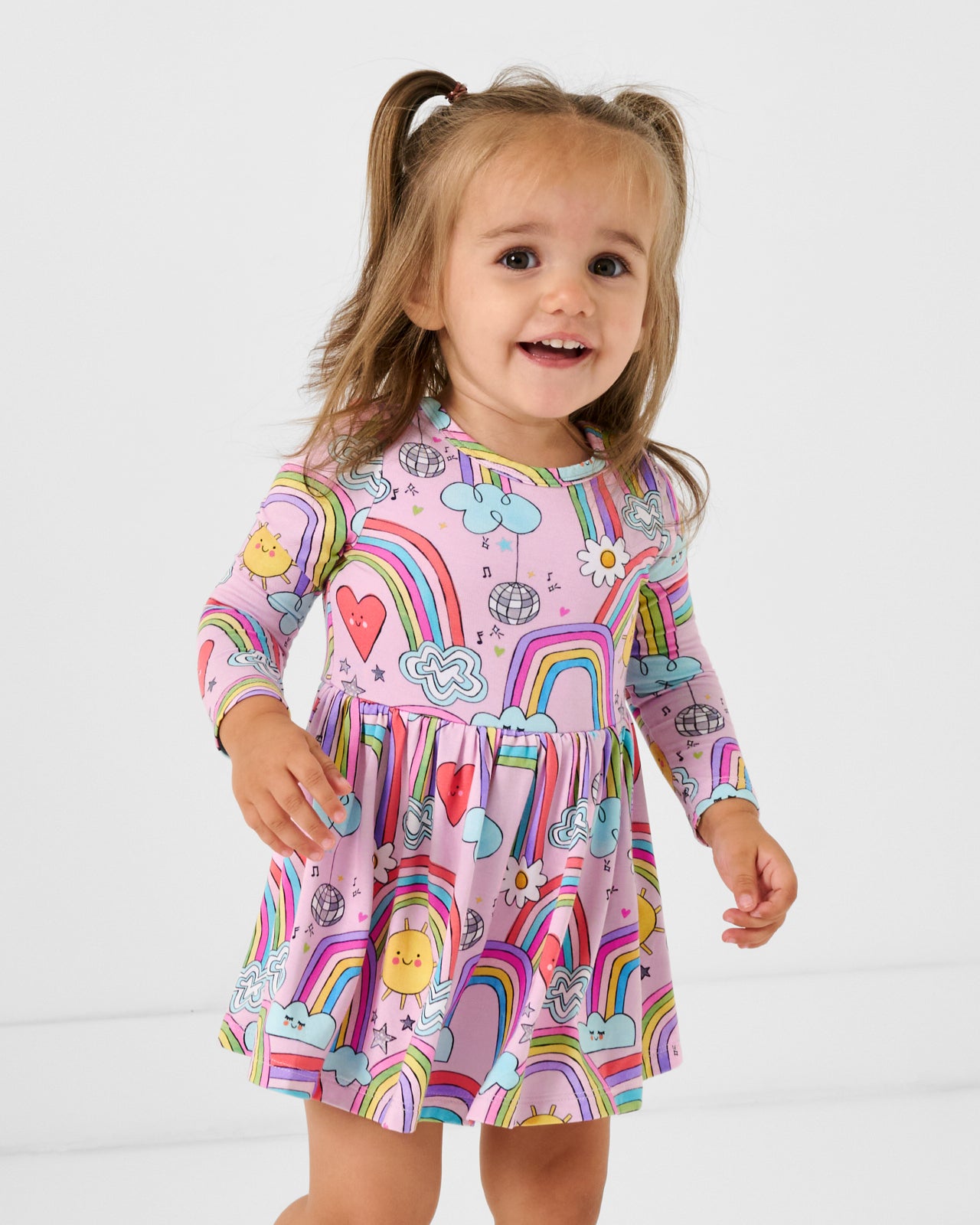 Girl wearing the Disco Rainbows Skater Dress with Bodysuit