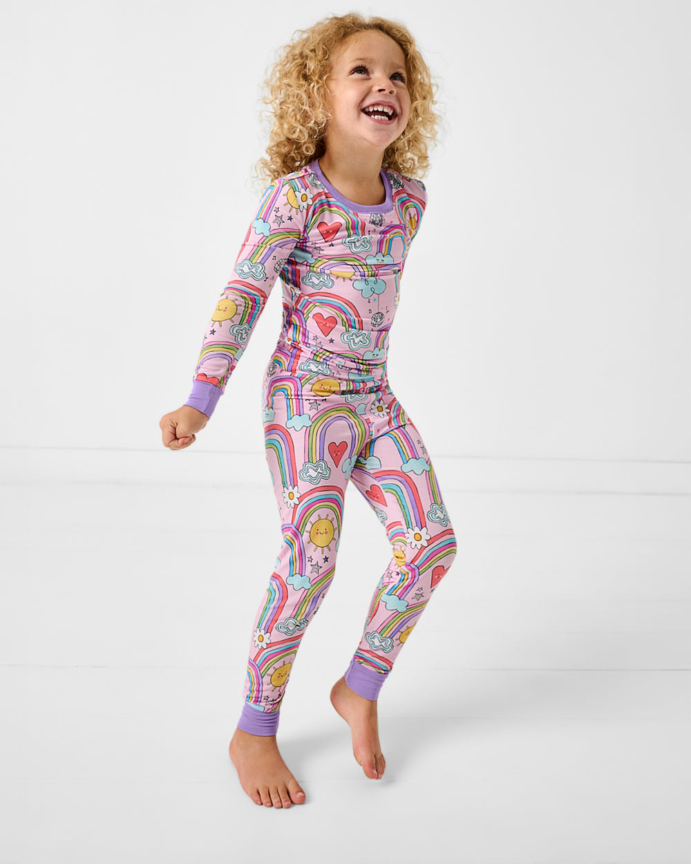 Girl wearing the Disco Rainbows Two-Piece Pajama Set
