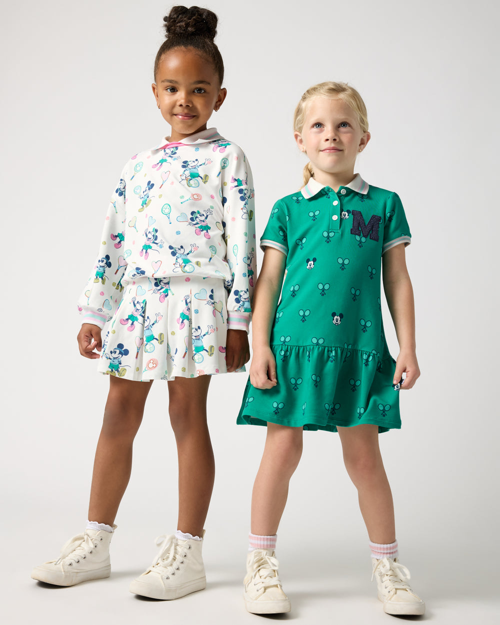 Two girls wearing Disney Mickey Mouse Varsity styles