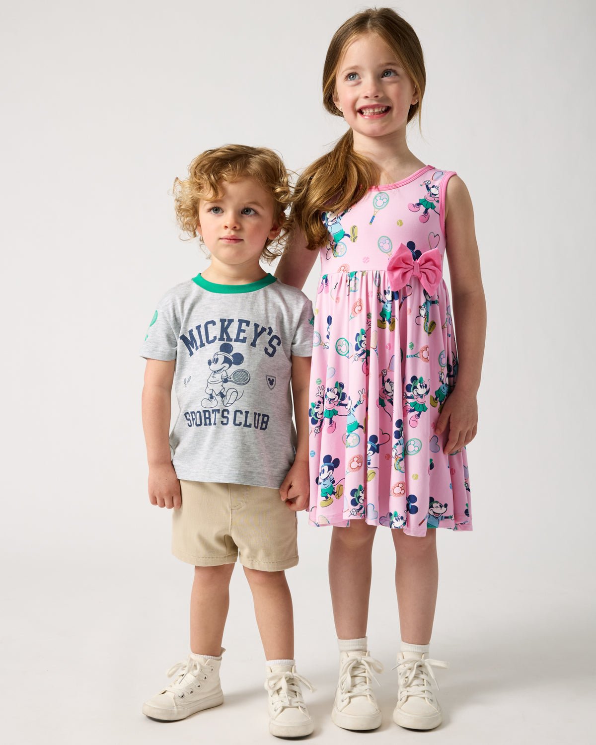 Two children wearing Disney Mickey Mouse Sports Club Varsity styles