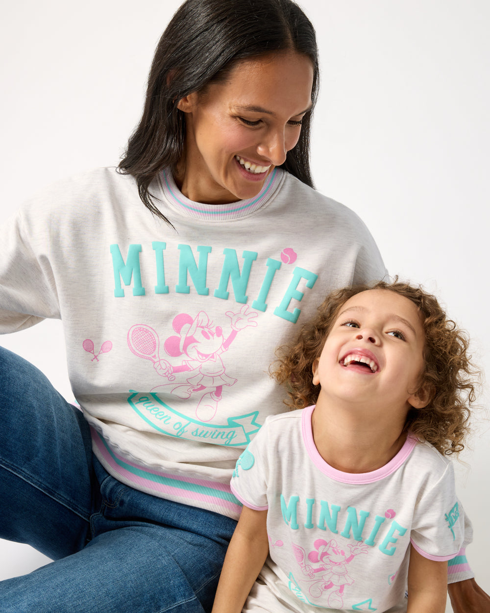 Mother and daughter wearing matching Disney Minnie Mouse Queen of Swing styles