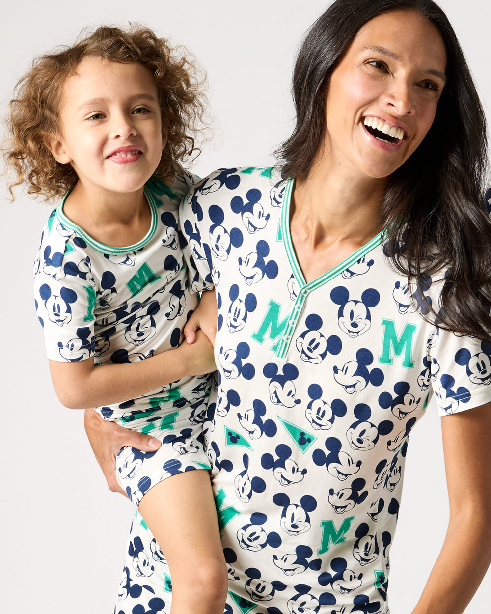 Mother and daughter wearing matching Disney Varsity Mickey Mouse Pajamas