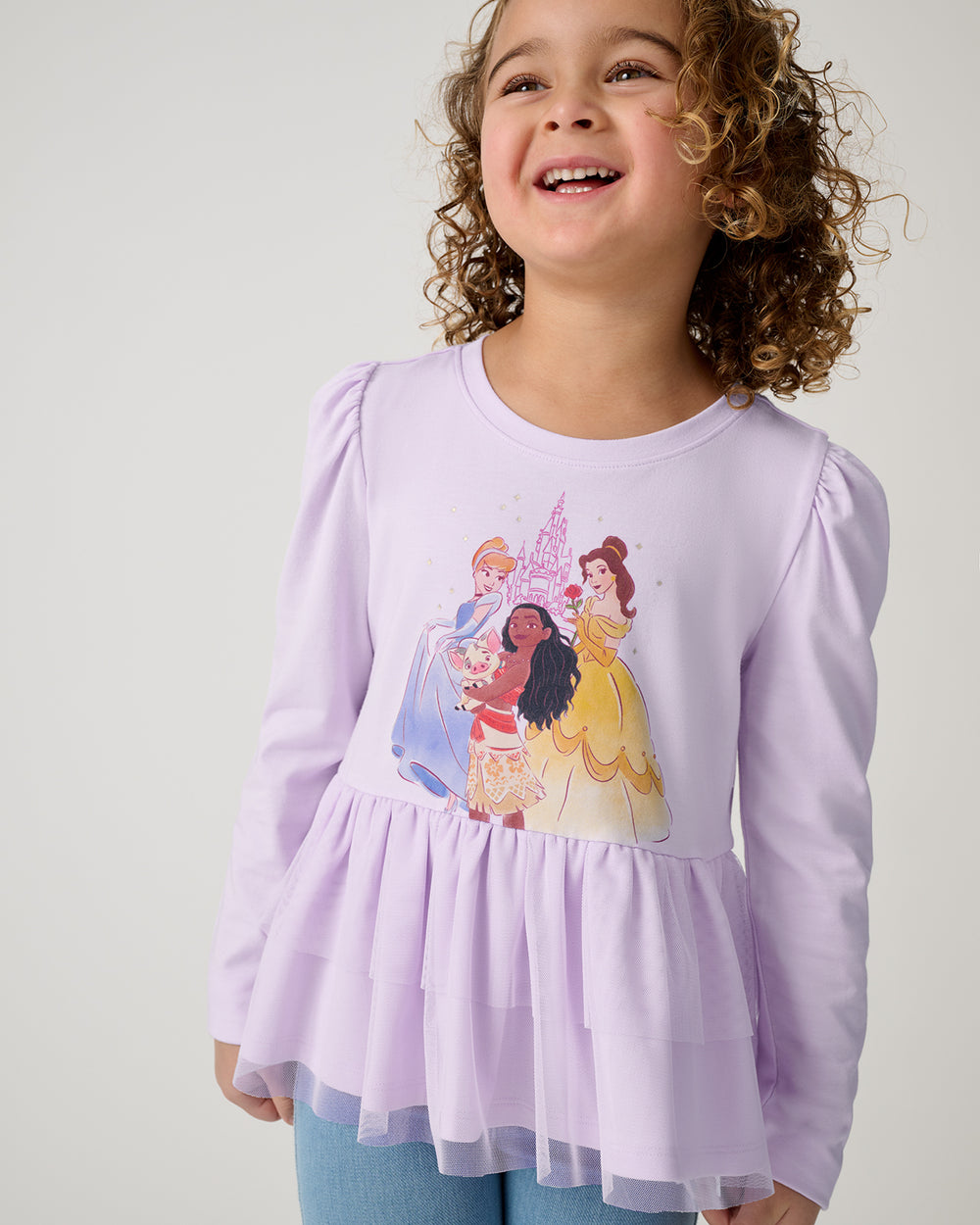 Close up of girl wearing the Disney Castle Daydream Peplum Top