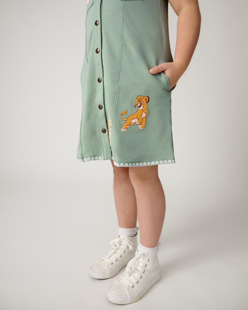 Close up of the Simba graphic detail on the Disney Cub Club Button Dress