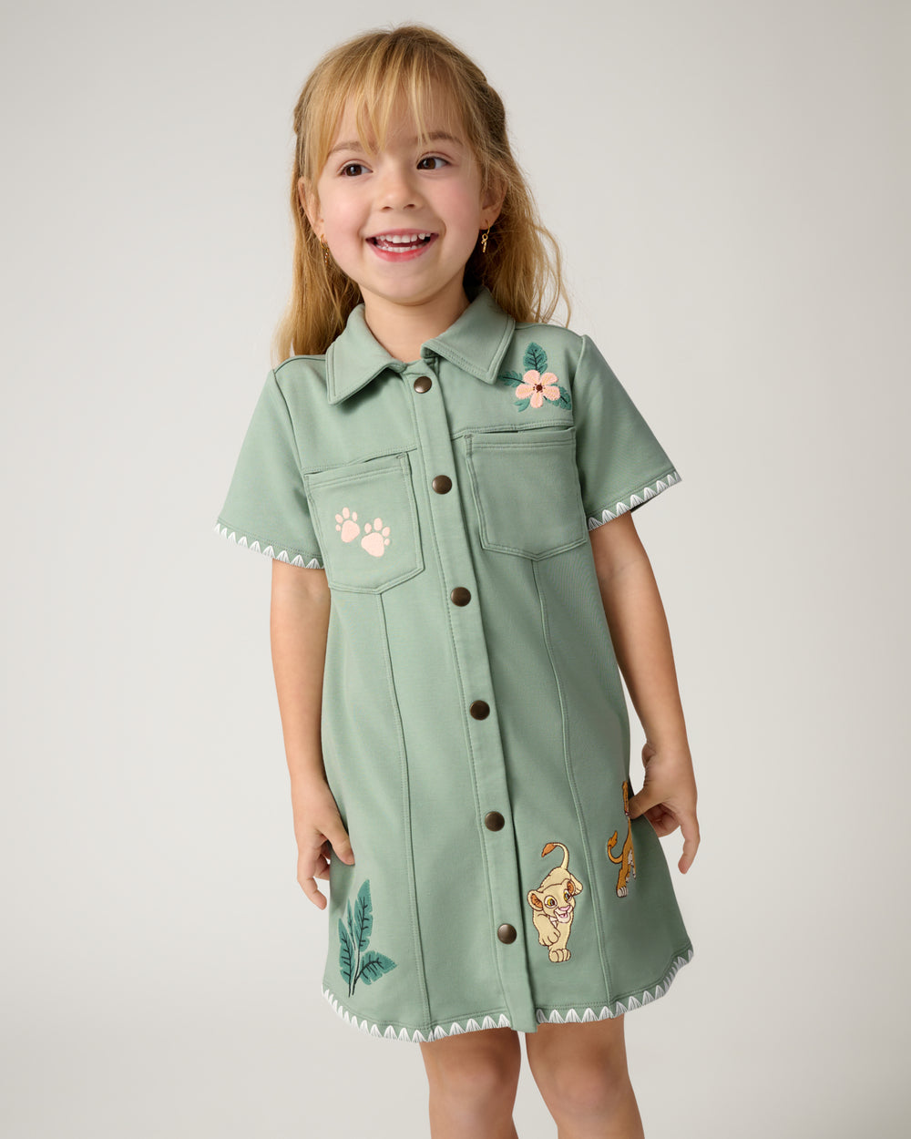 Girl wearing the Disney Cub Club Button Dress