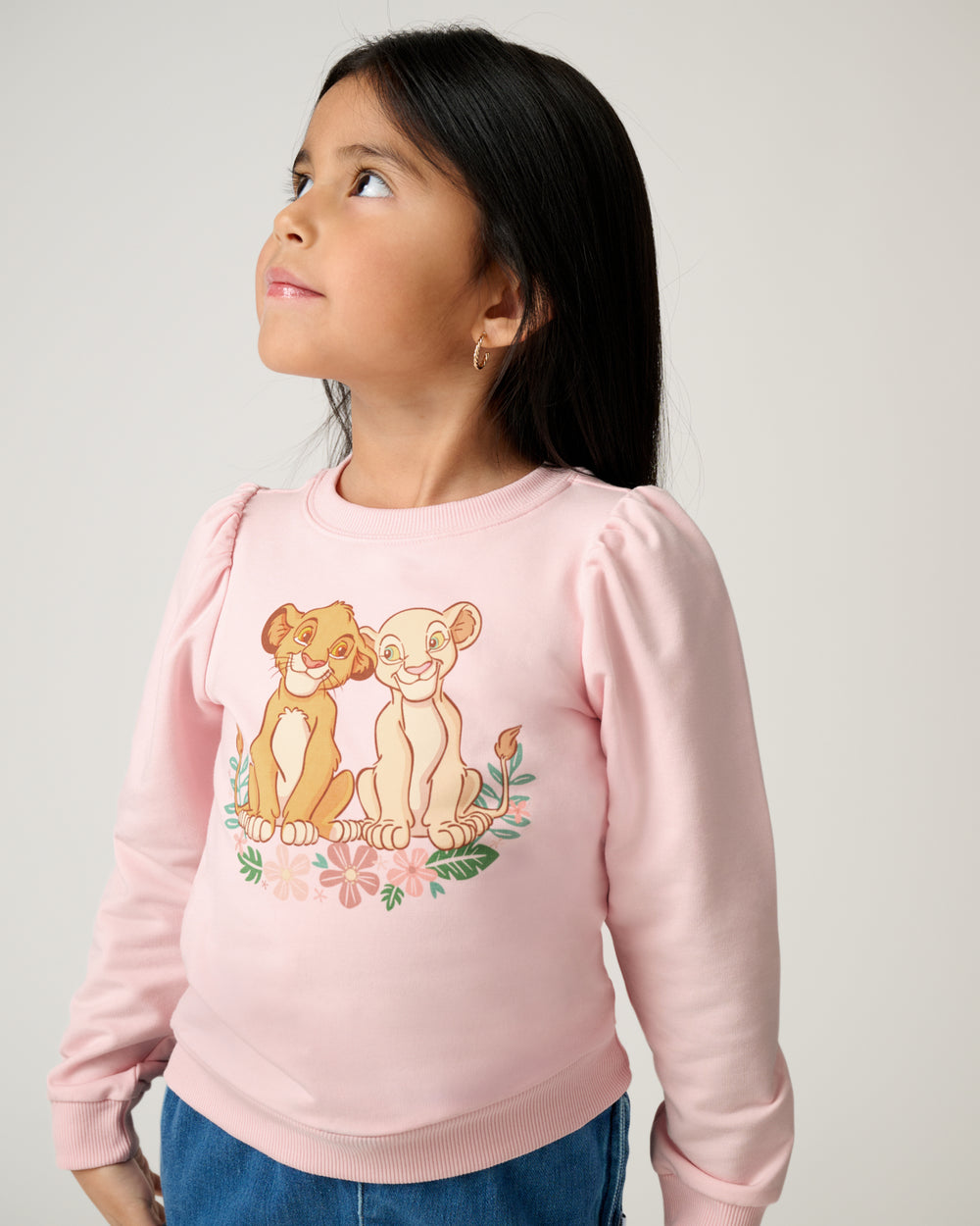 Close up of girl wearing the Disney Cub Club Puff Sleeve Crewneck