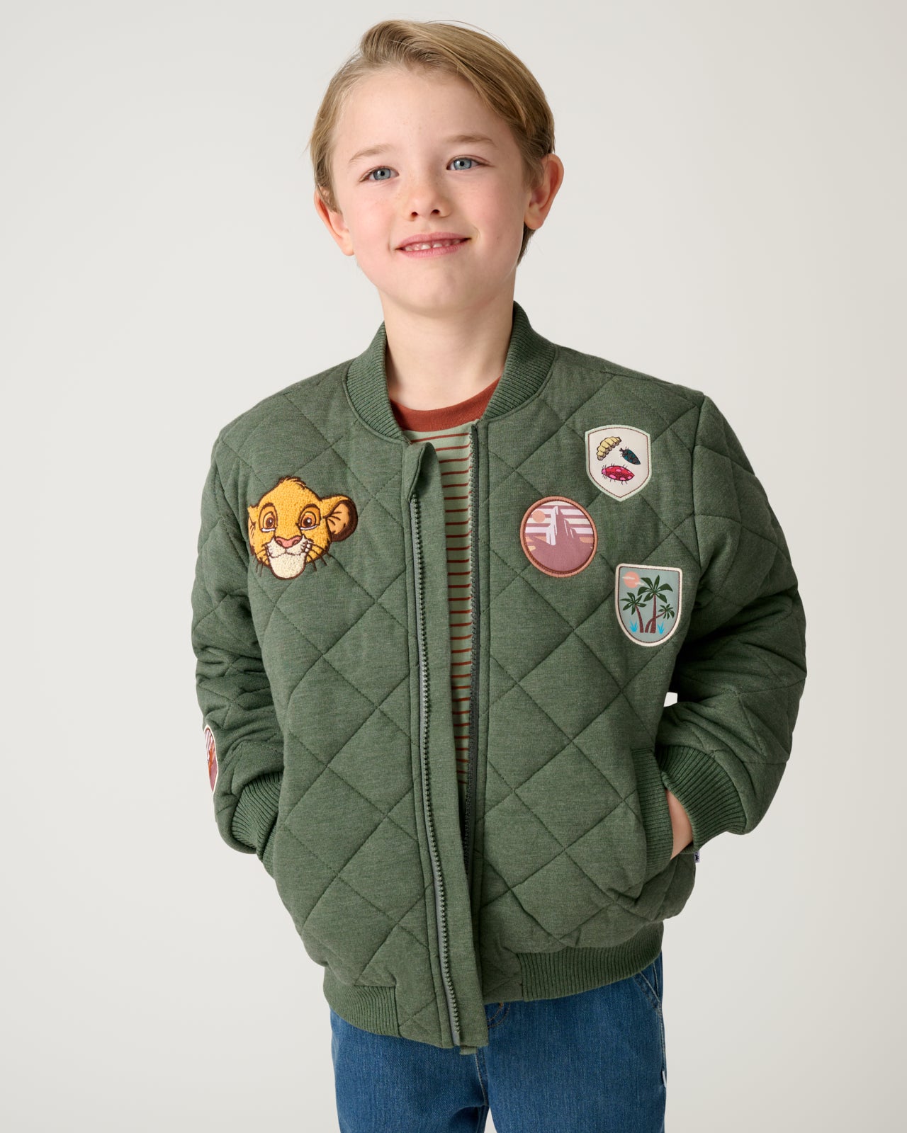 Boy wearing the Disney Explore The Wild Quilted Varsity Jacket