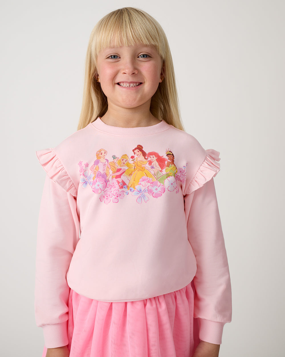 Close up of girl wearing the Disney Floral Fairytale Flutter Crewneck