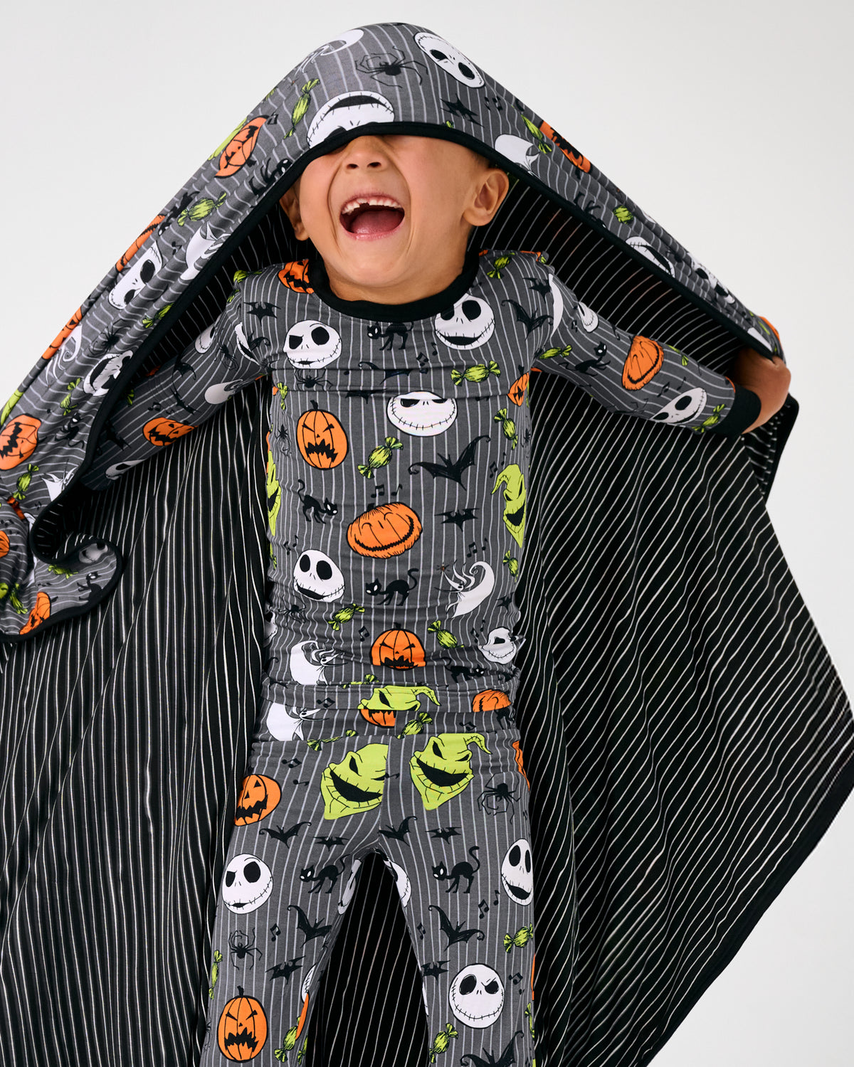 Alternate child holding up the Disney The Nightmare Before Christmas Large Cloud Blanket®