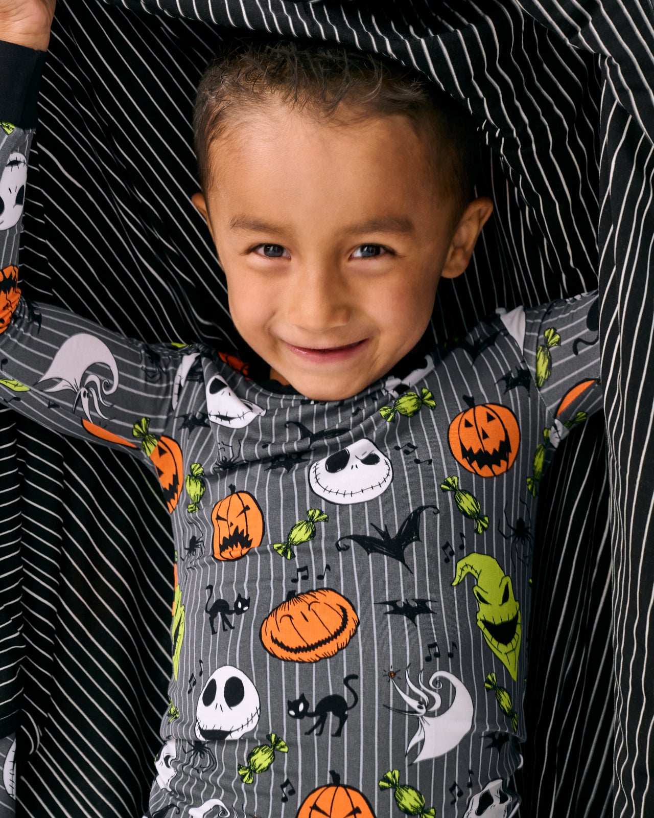Close up of child wrapped in the Disney The Nightmare Before Christmas Large Cloud Blanket®