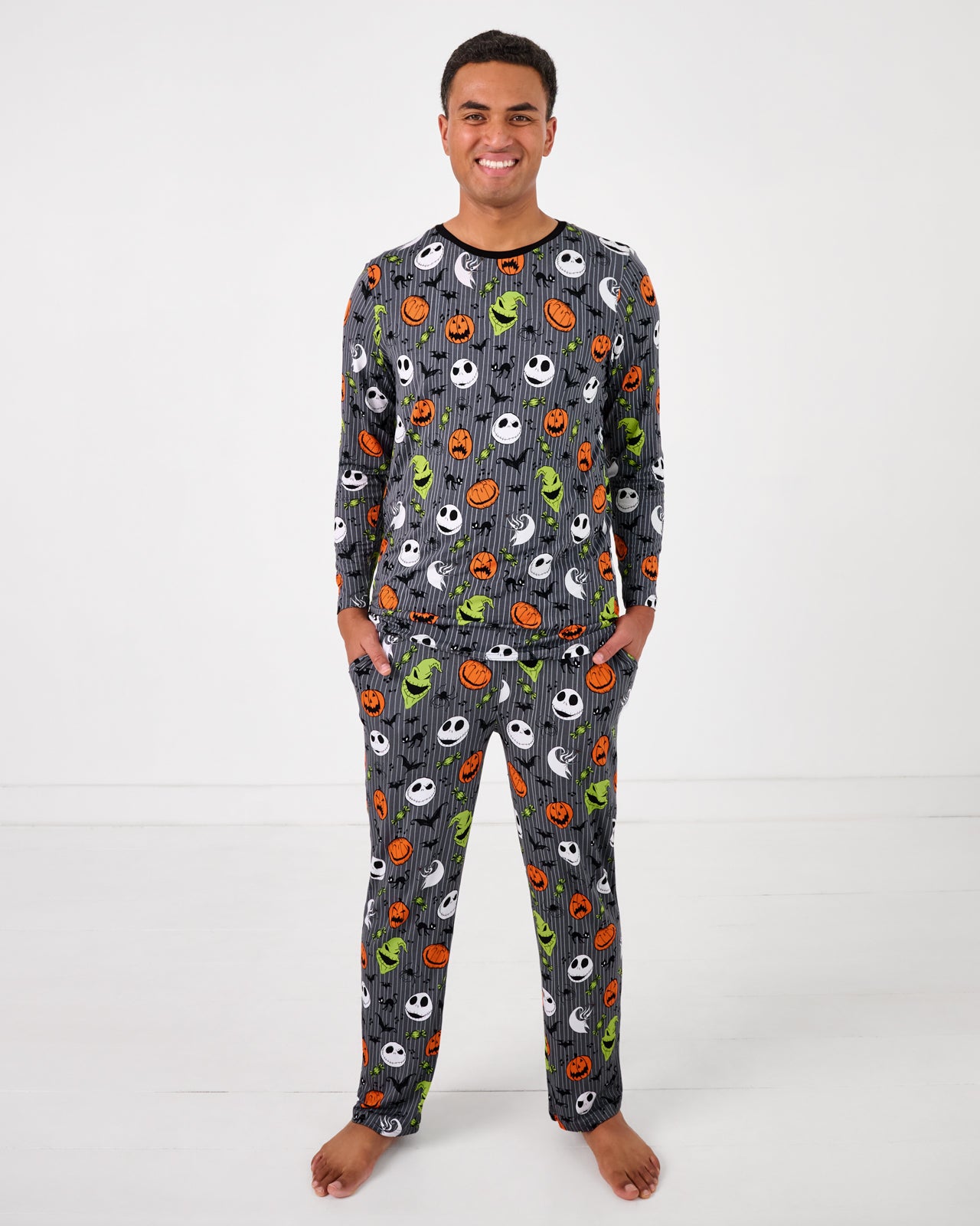 Standing man wearing the Disney The Nightmare Before Christmas Men's Pajama Pants with a matching bamboo pajama top