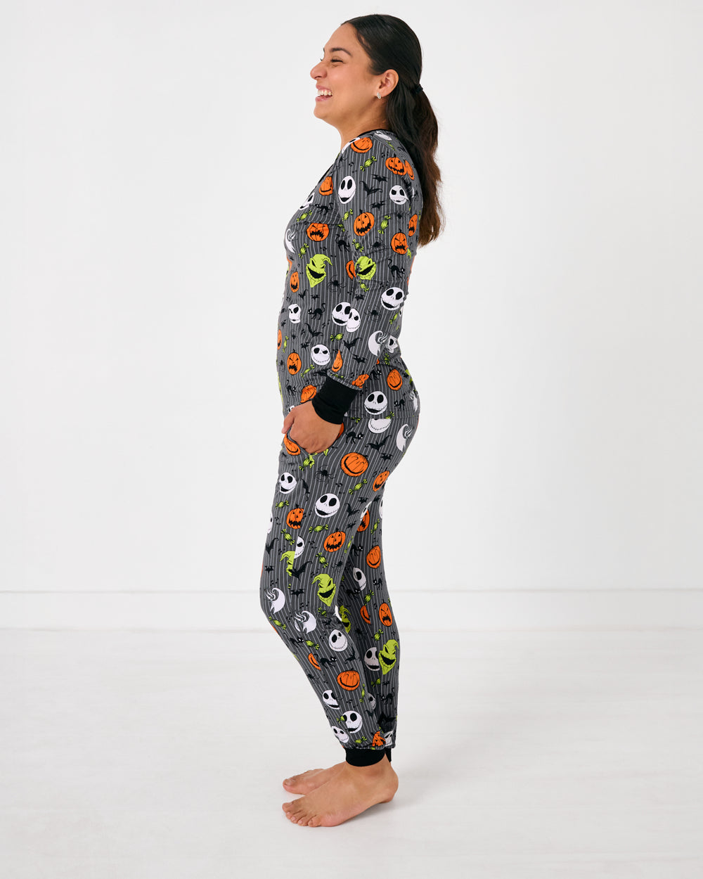 Side view of standing woman wearing the Disney The Nightmare Before Christmas Women's Pajama Pants