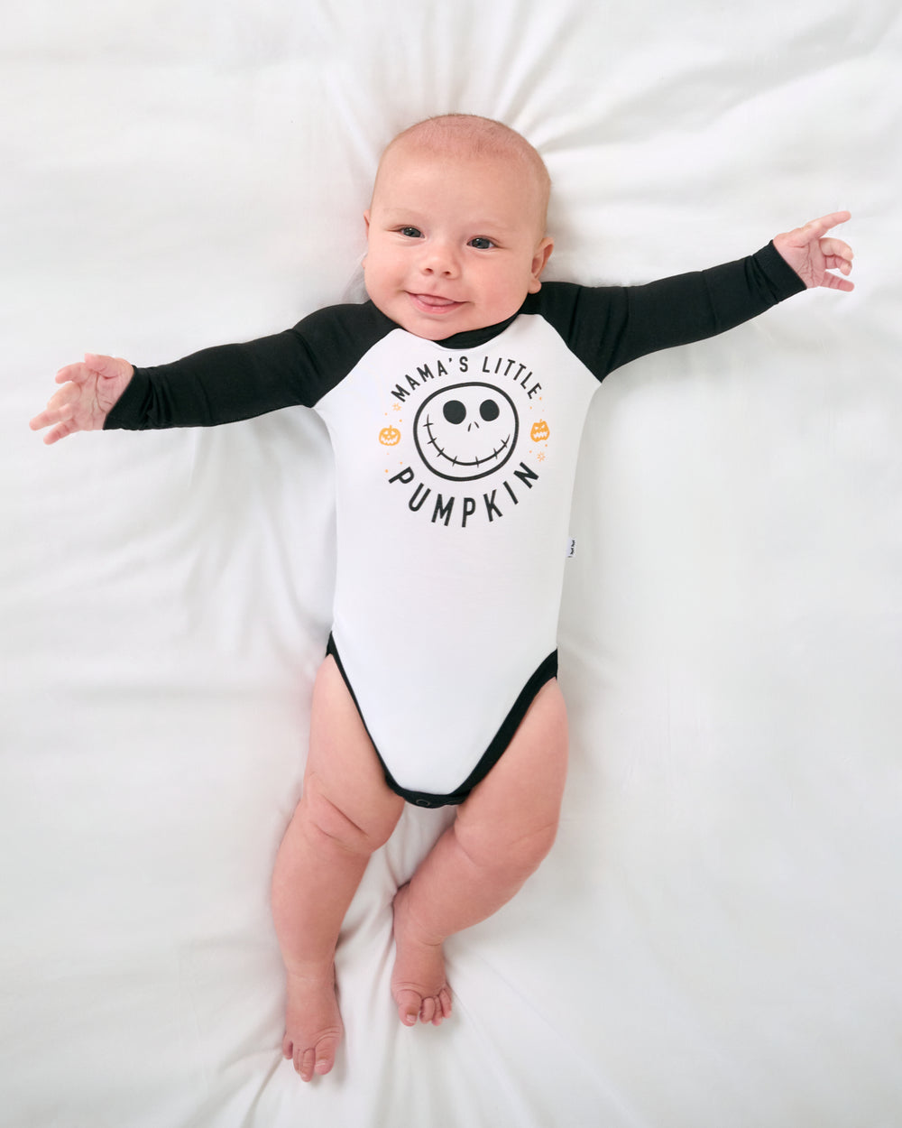 Aerial view of baby wearing the Disney Mama's Little Pumpkin Raglan Bodysuit
