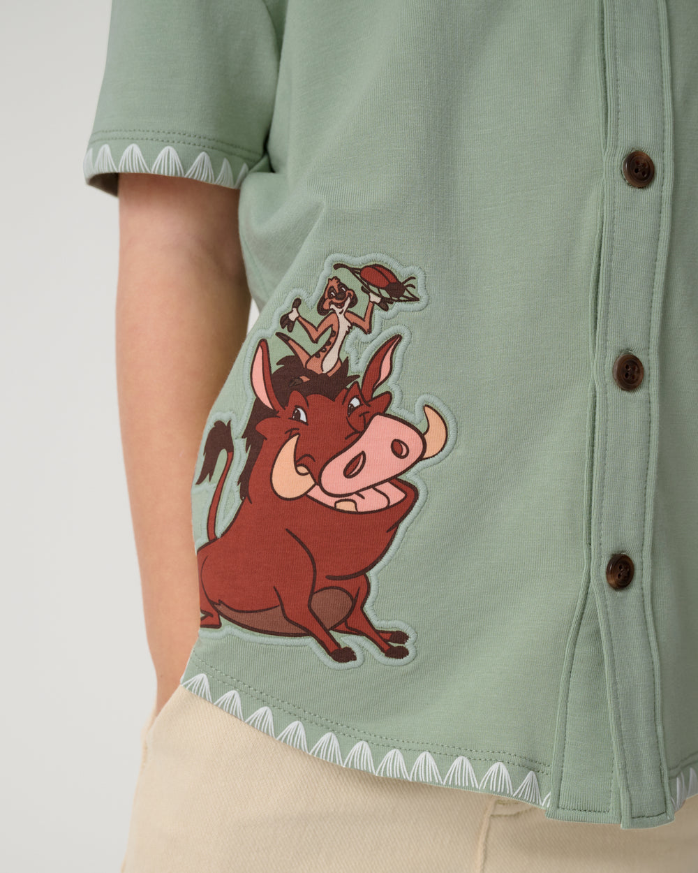Close up of the graphic detail on the Disney Jungle Trio Button Down Shirt