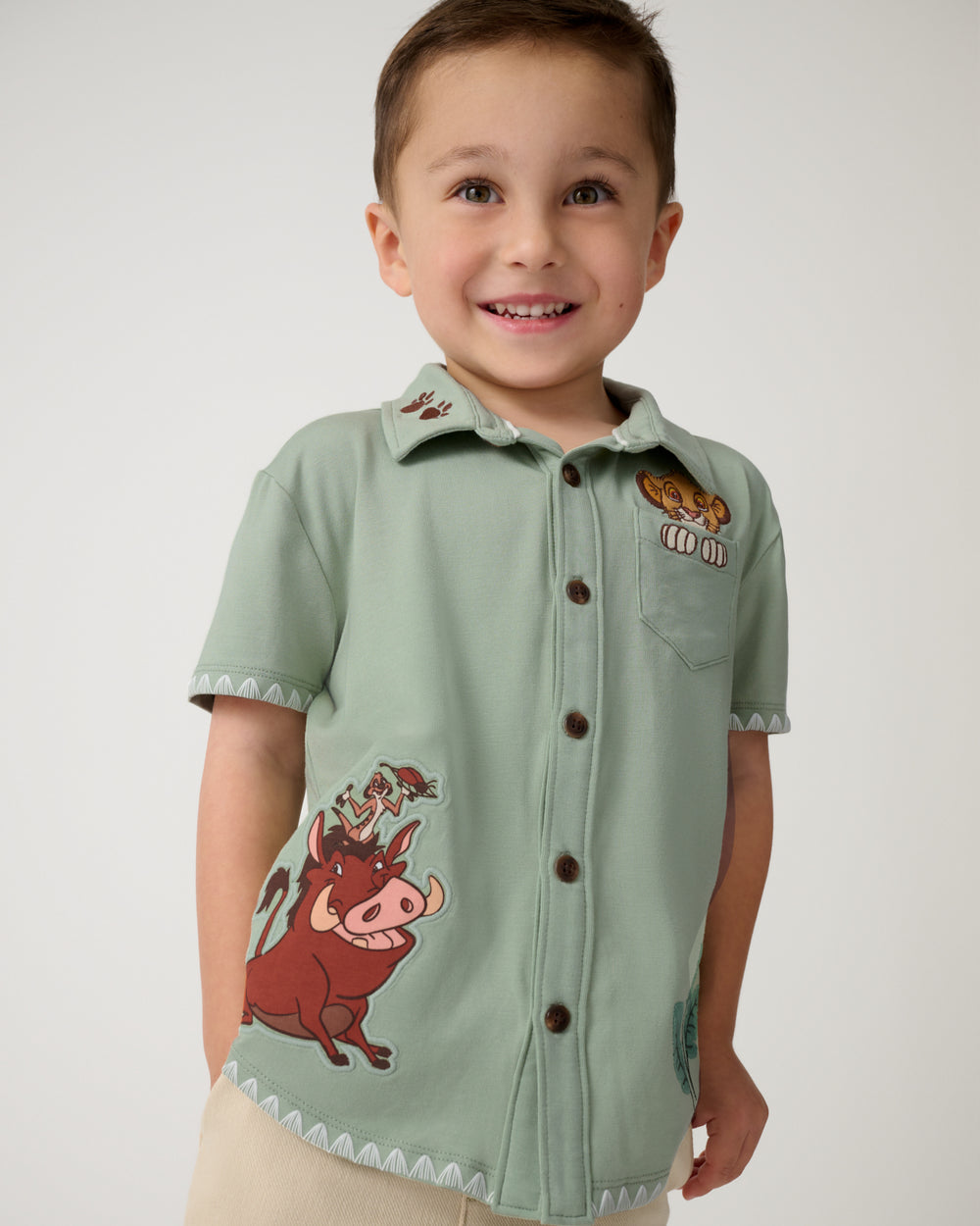 Boy wearing the Disney Jungle Trio Button Down Shirt
