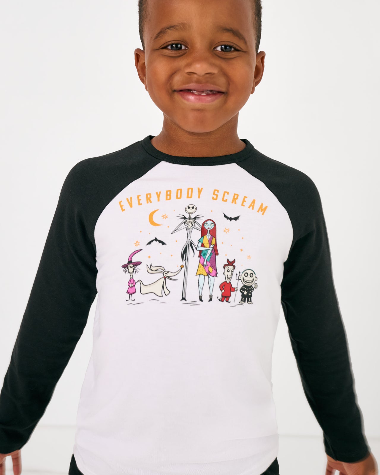 Close up of boy wearing the Disney Everybody Scream Raglan Tee