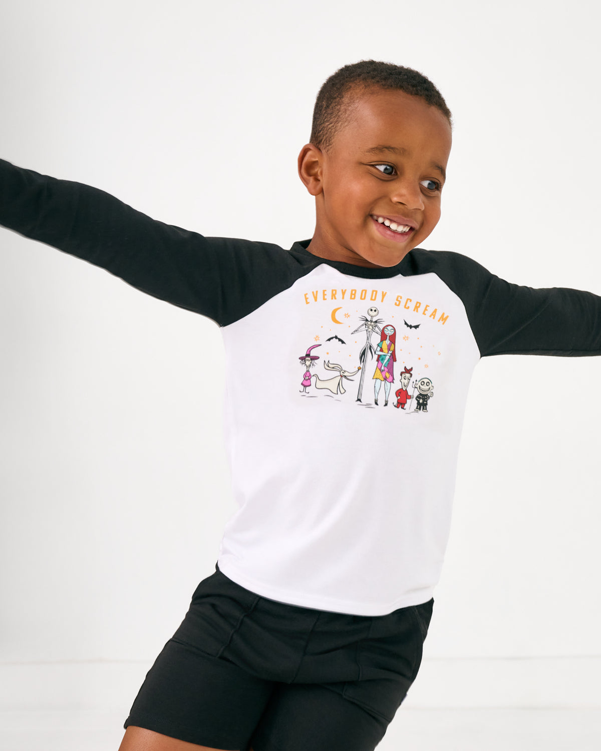 Child in motion wearing the Disney Everybody Scream Raglan Tee