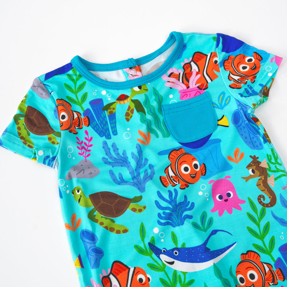 Close up of the pocket detail on the Nemo's Reef Shorty Pocket romper