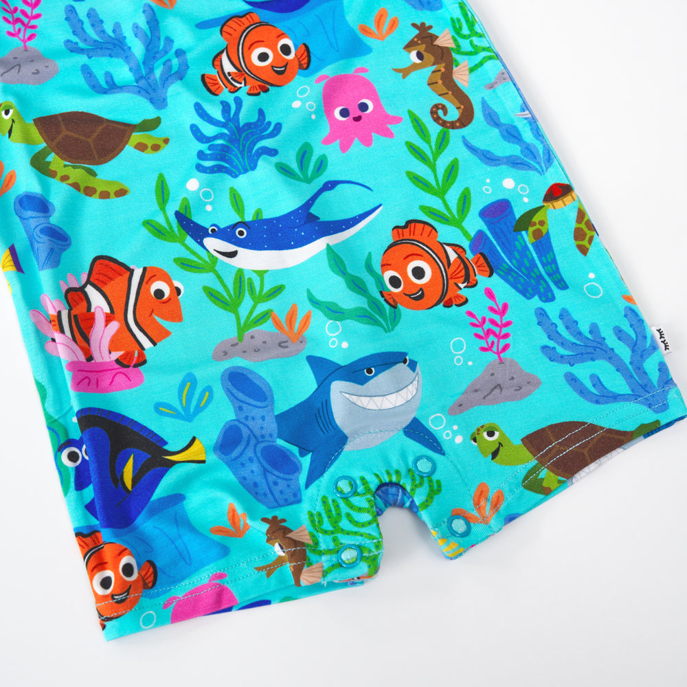 Close up of the snap button detail on the Disney Nemo's Reef Pocket Shorty Romper