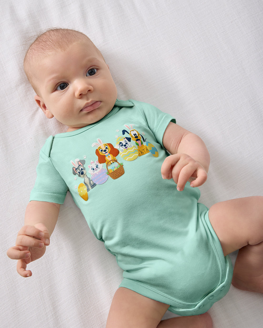 Aerial view of baby wearing the Disney Peekaboo Pets Bodysuit