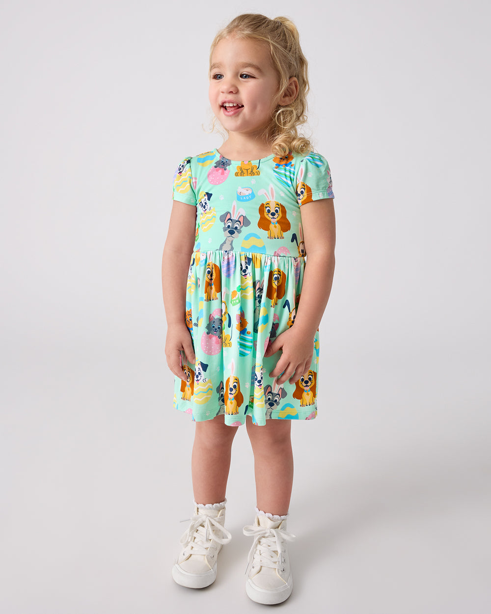 Standing girl wearing the Disney Peekaboo Pets Bow Back Skater Dress