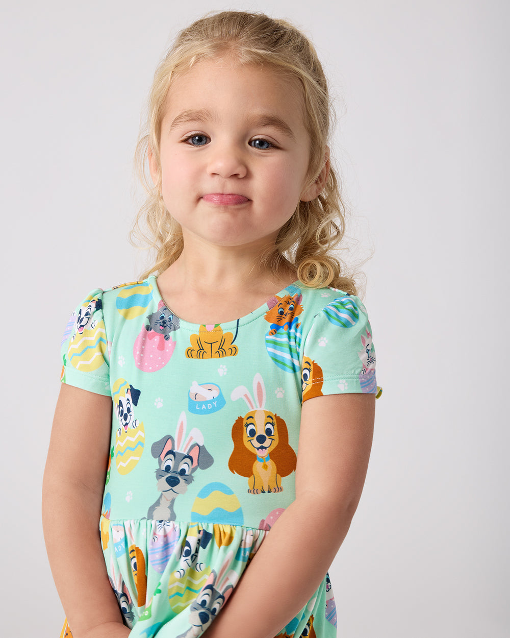 Close up of girl wearing the Disney Peekaboo Pets Bow Back Skater Dress