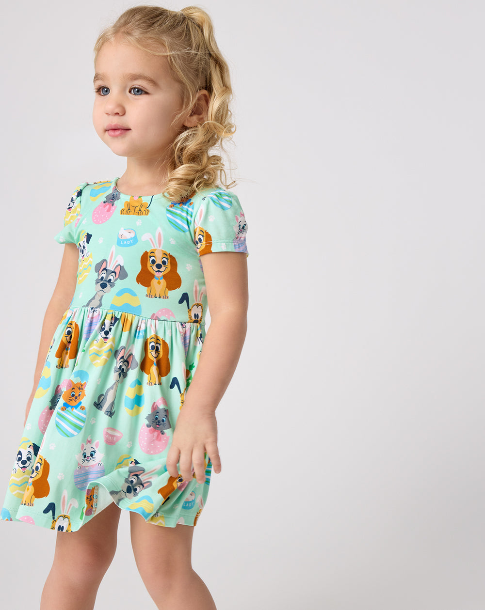 Girl wearing the Disney Peekaboo Pets Bow Back Skater Dress on a white background