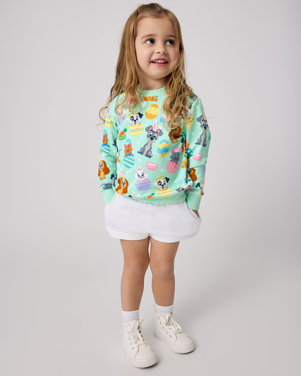 Standing girl wearing the Disney Peekaboo Pets Crewneck Sweatshirt