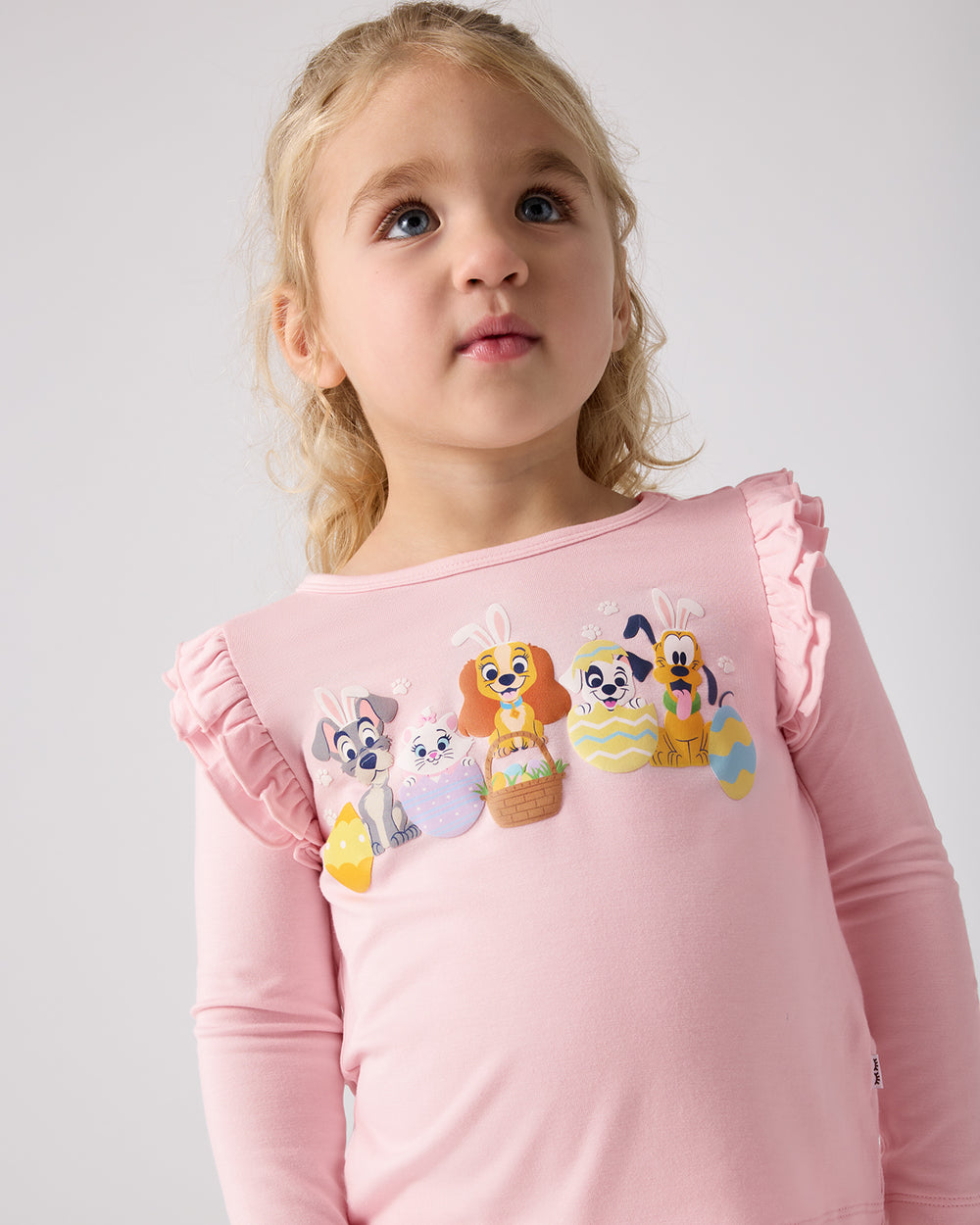 Girl wearing the Disney Peekaboo Pets Flutter Tee