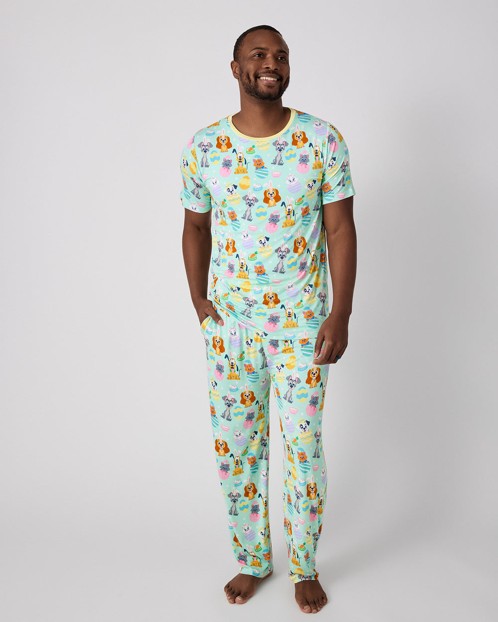 Man wearing the Disney Peekaboo Pets Men's Pajama Pants and Top