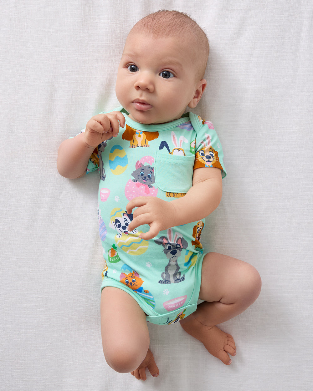 Aerial view of baby wearing the Disney Peekaboo Pets Pocket Bodysuit